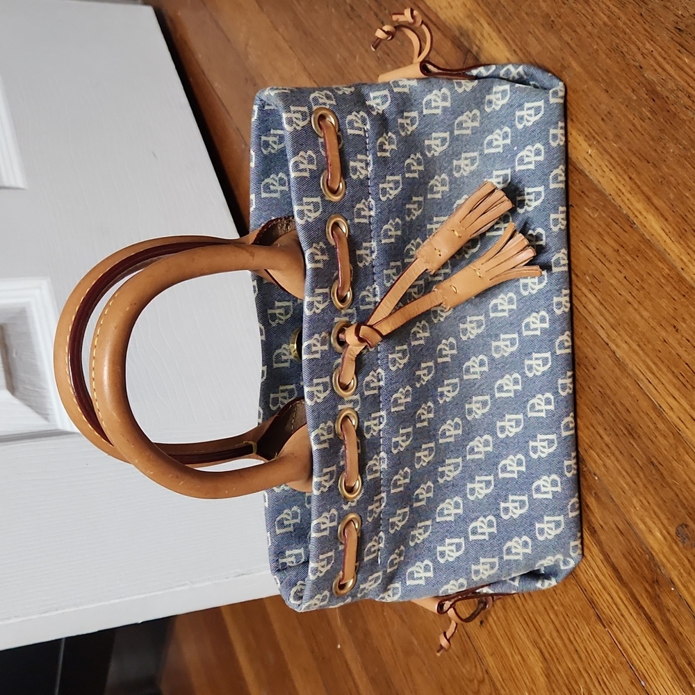 Dooney and Burke blue and cream handbag. Lightly used. Scuff marks shown in pics